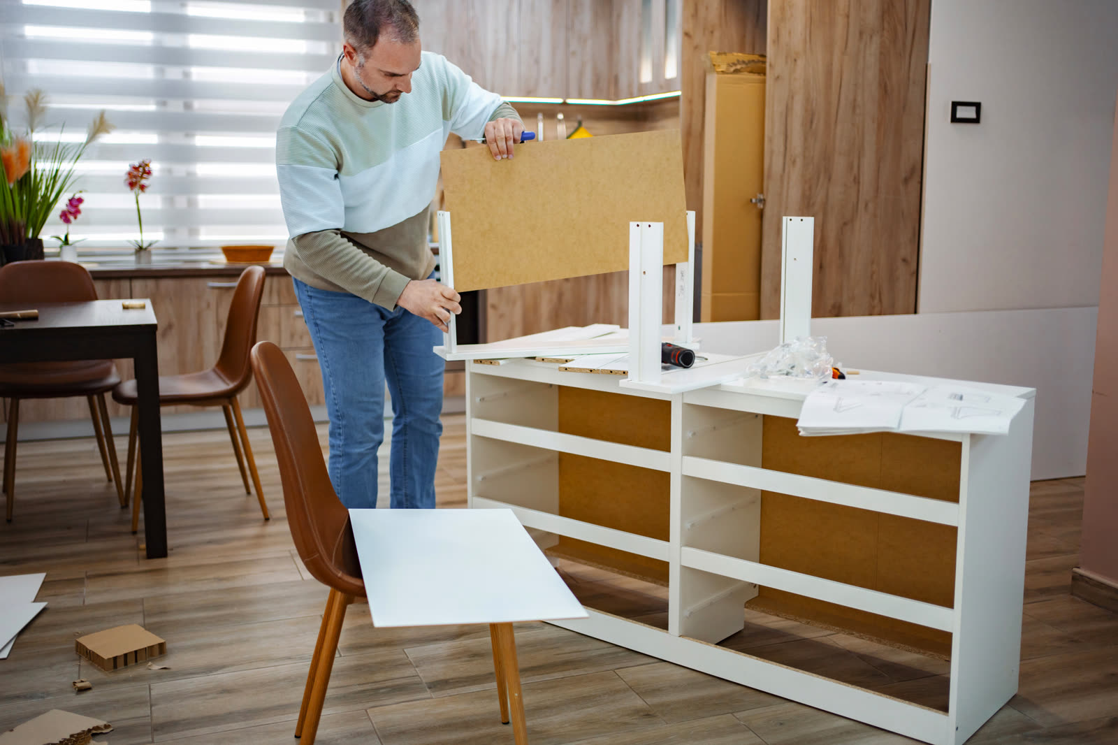 Building a modern furniture piece in a cozy living — the kind of handyman work vetted local pros handle in Sarasota, FL