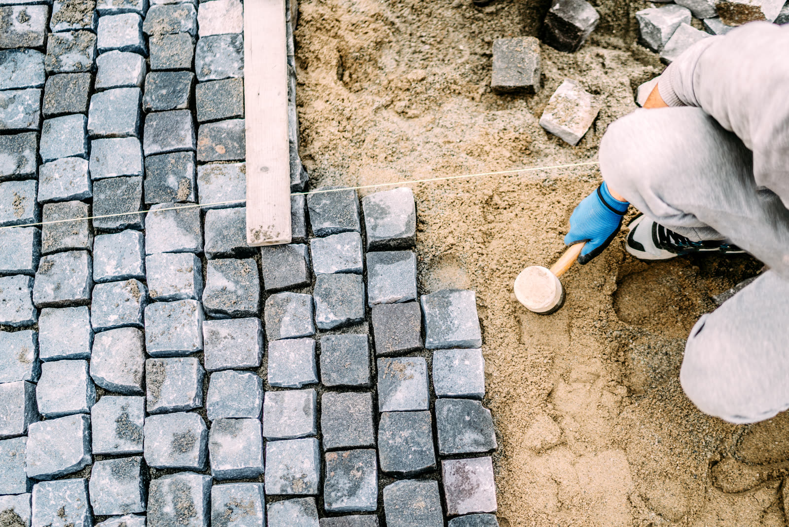 Pavers set and tapped level with a rubber mallet