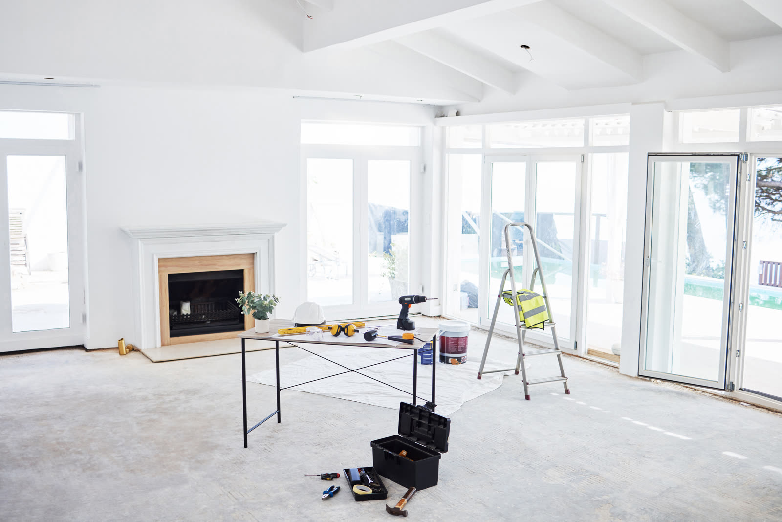 Shot of building plans and equipment on a table in — the kind of handyman work vetted local pros handle in Sarasota, FL