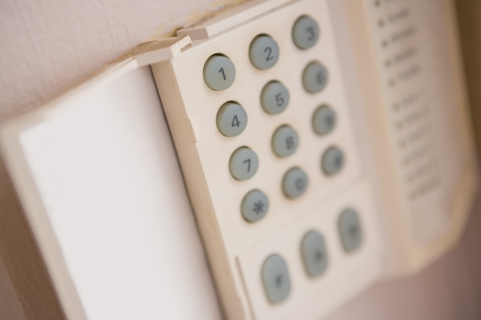 Close up of home security keypad on the wall — the kind of handyman work vetted local pros handle in Sarasota, FL