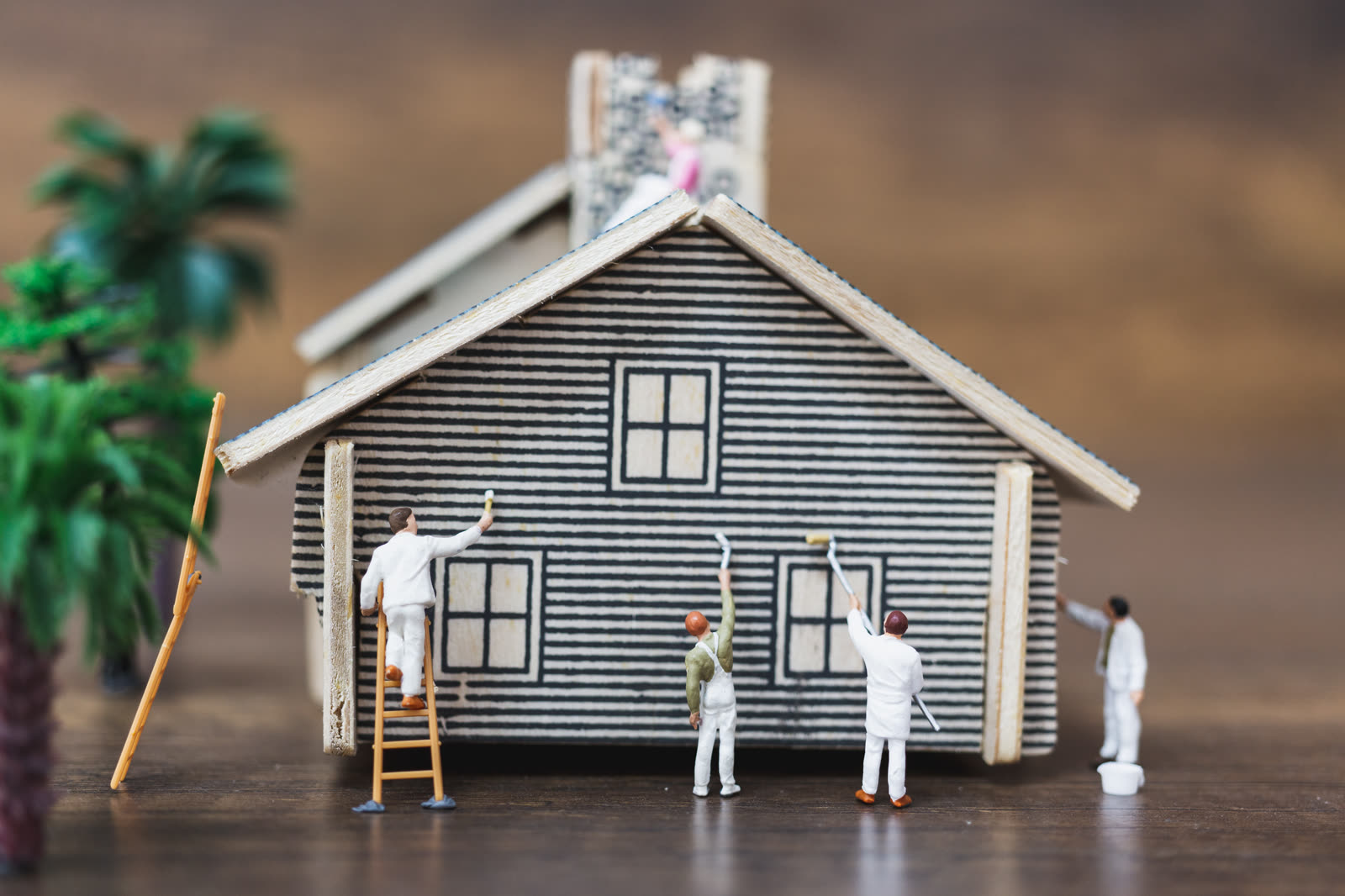 miniature people workers team painting a new home — Painting (Interior & Exterior) in Sarasota, FL