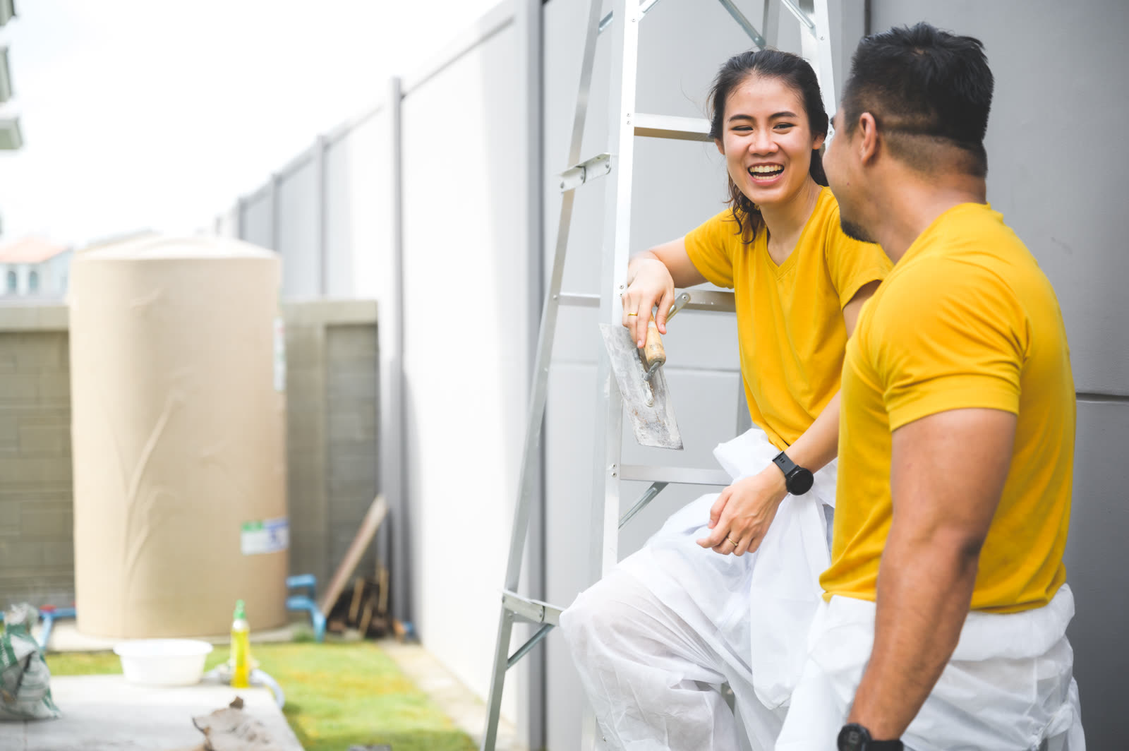 Couple painting the wall lovely concept — the kind of move-in & move-out work our vetted local pros handle in Sarasota, FL