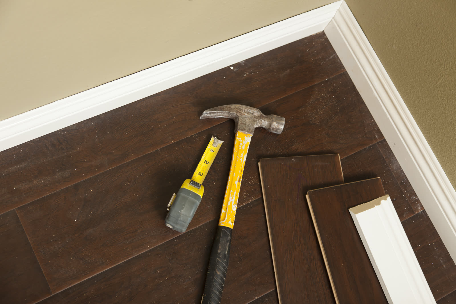 hammer laminate flooring and new baseboard moldin — Tile and Flooring in Sarasota, FL