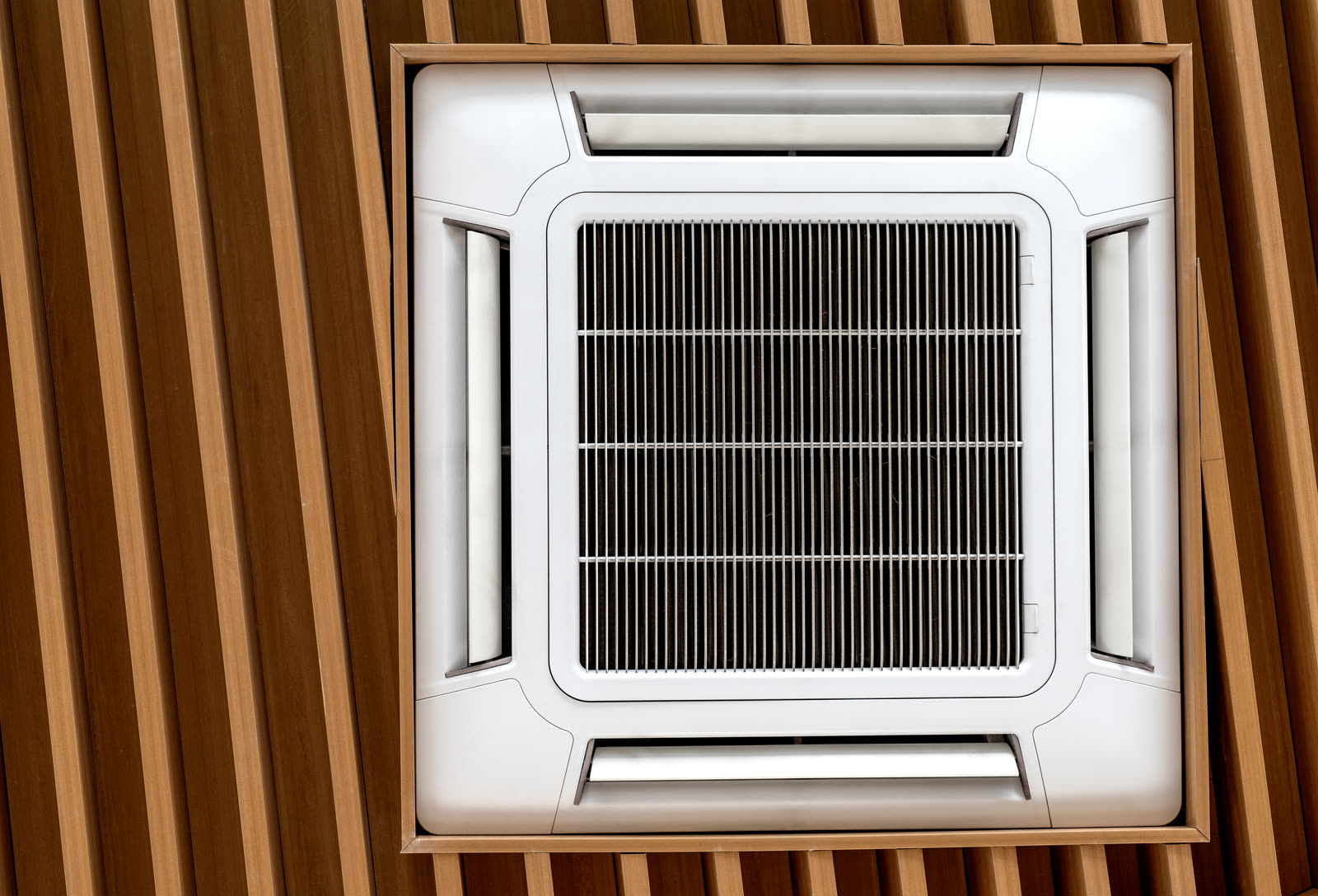Air conditioner cassette type installed on wooden — the kind of handyman work vetted local pros handle in Sarasota, FL