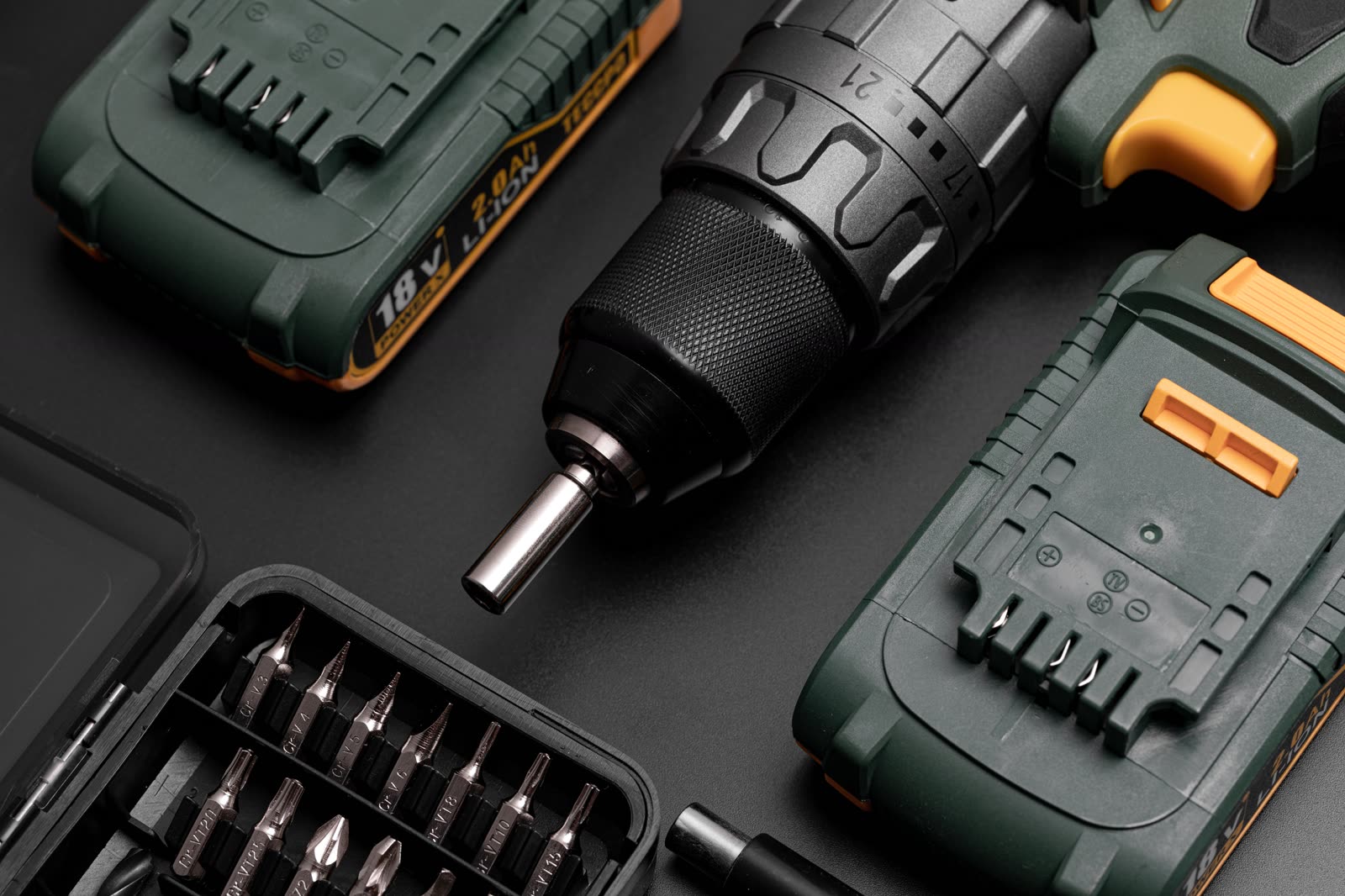 electric drill 18v with accessories on a black bac — Window AC Installation & Repair in Sarasota, FL